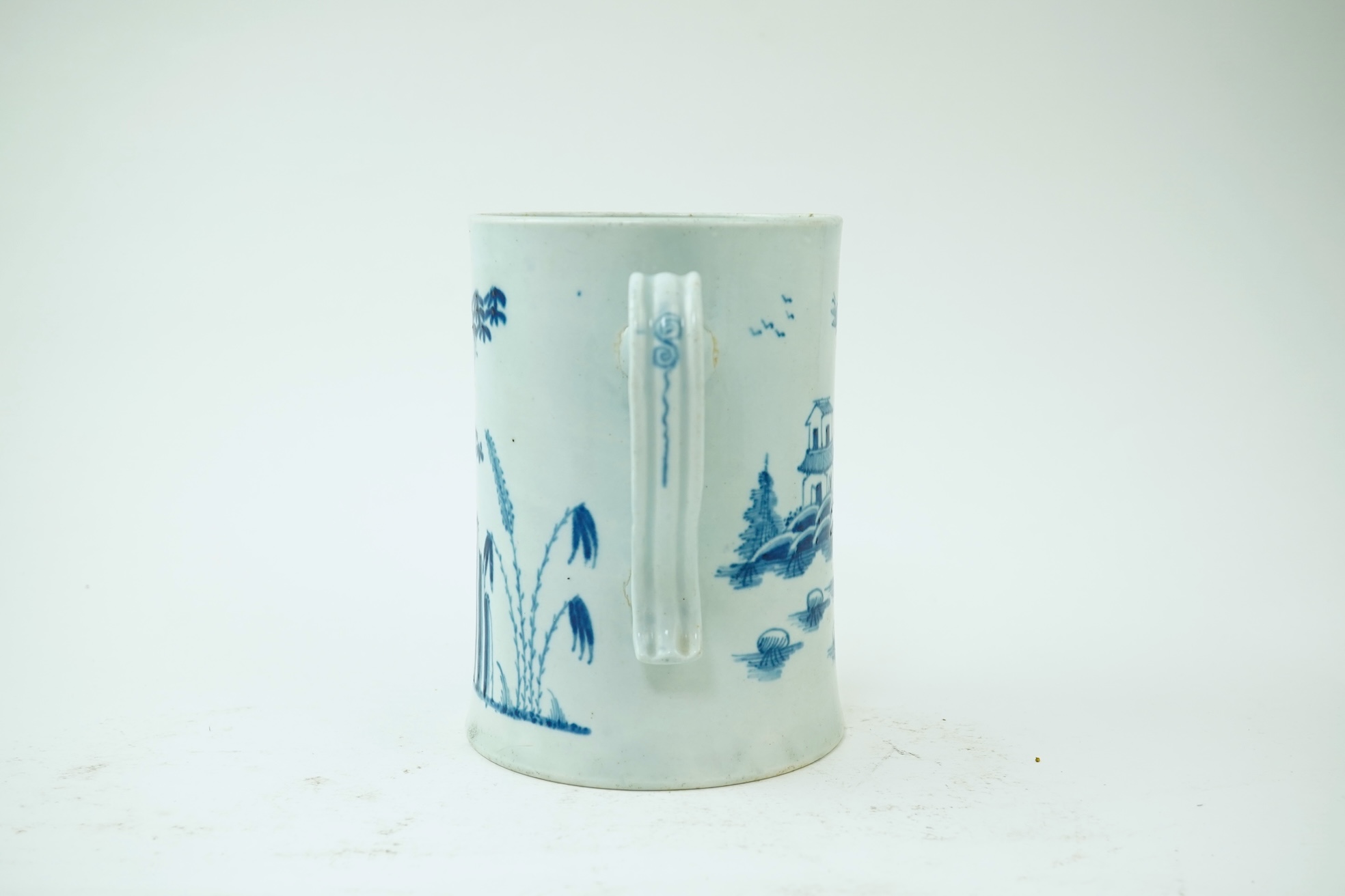 A large Worcester blue and white scratch cross type mug or tankard decorated in the Plantation pattern, c.1754-56